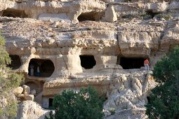 Tourists at Matala Caves near beach in Iraklion, Crete, Greek