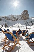People relaxing in Rifugio Scotoni at Conturines mountain, Alta Badia, South Tyrol, Italy