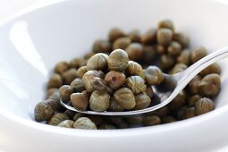 Close-up of spoon with pickled capers
