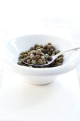 Close-up of spoon with pickled capers