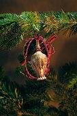 Close-up of various tree ornaments hanging on Christmas tree