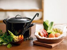 A pot and soup ingredients