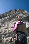 Man climbing on rock mountain at Franconian Switzerland, Bavaria, Germany