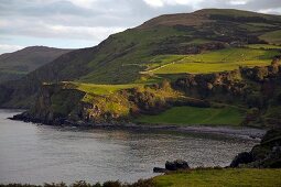 View of Antrim Coast Torr Head mountain with green coast, Ireland, UK