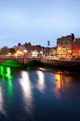 Illuminated O'Connell Bridge over River Liffey at night, Dublin, Ireland, UK
