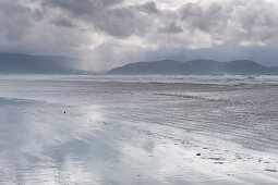 View of mountains, fog and clouds at Ring of Kerry Inch Beach, Ireland, UK