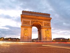 People walking in front of Arc de Triomphe on Place Charles de Gaulle in Paris, France