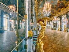 Hall of Versailles Palace with mirrors, frescoes and chandelier in France