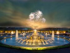 View of Illuminated Latona Fountain at dusk in Versailles, France