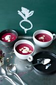 Cream of beetroot soup in small soup bowls