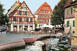 View of Market place, half-timbered houses and fountain in Ladenburg, Germany