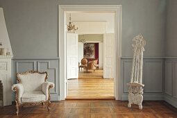 Interior of room with armchair and wooden floor