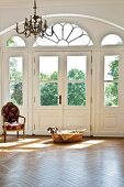 Dog relaxing in hall of Marihn castle, Germany