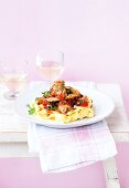 Tomato ragout with chicken and basil on a bed of tagliatelle
