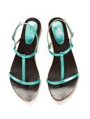 Turquoise thong sandals in metallic look on white background