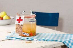 A jar of homemade chicken soup to take to somebody in hospital
