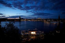 View of Stockholm cityscape at night with ships in Sweden