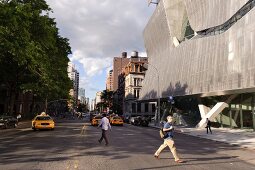 People crossing road at East Village near Cooper Union, New York, USA