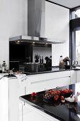 Kitchen with working area and basket of tomatoes