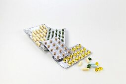 Close-up of pills pack on white background