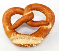 Whole grain pretzels on white background