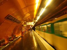 Senior woman waiting at Arts et Metiers metro station in Paris, France