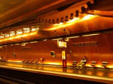 Senior woman waiting at Arts et Metiers metro station in Paris, France