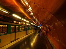 Senior woman waiting at Arts et Metiers metro station in Paris, France