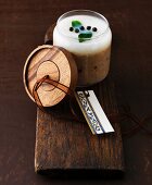 Homemade venison rillettes in a decorative glass jar as a gift