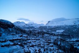 View of snow mountain and Hemsedal ski resort at dusk in Norway