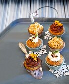 Poppy seed cupcake with mascarpone and caramel toppings on tray
