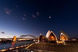 View of Opera House and Harbour Bridge at night in Sydney, New South Wales, Australia