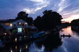 View of  Stamford Hill, Floating Cinema and river Lee in East End at dusk, London, UK