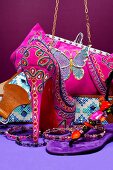 Compilation of colourful accessories, shoes and bag in pink