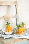 Exotic fruit salad made with oranges and papaya with fresh mint