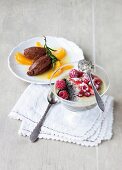 Chocolate cream with oranges and poppyseed mousse with berries