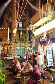 People at coffee house in evening at Corniche, Cairo, Egypt