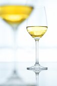 Close-up of two glasses of white wine