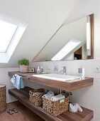Interior of bathroom with vanity sink with mirror and container