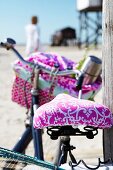 Close-up of pink bicycle seat and saddle cover