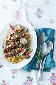 Mushroom fettuccine with figs and lamb skewers