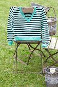 Stripe sweater on chair in garden