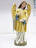 Restored Nayivity angel figure in golden robe