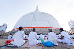 People praying at temple square Stupa of Mirisawetiya, Anuradhapura, Sri Lanka