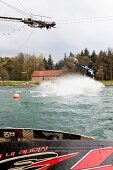 Man water skiing in lake, Dankern Castle, Haren, Germany