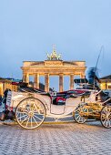 Carriage in front of Brandenburg Gate at Mitte district, Berlin, Germany