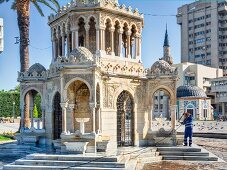 People at Konak Square in front of Izmir Clock Tower in Aegean Region, Turkey