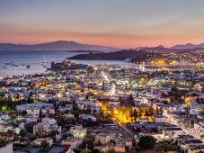Illuminated cityscape of Bodrum at dusk, Aegean Region, Turkey