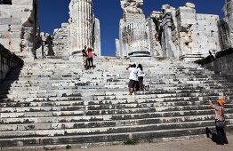 Two women photographing at temple of Apollo in Didyma, Turkey