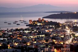 Illuminated cityscape of Bodrum at dusk, Aegean Region, Turkey